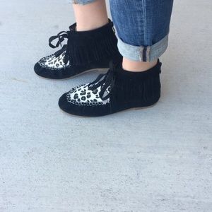 Fringe moccasin boots.